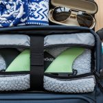 Surfboard fins packed safely in a padded fin travel case