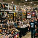 Horror convention dealer room filled with vintage movie posters and collectibles