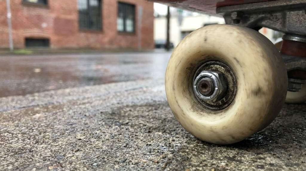 Skateboard wheel bearing spacer installation